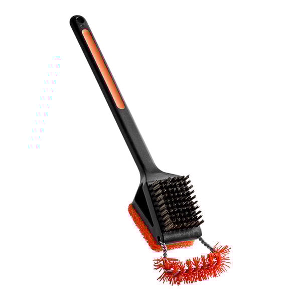 A Mr. Bar-B-Q grill brush with black and orange soft grip handle and wire brush.