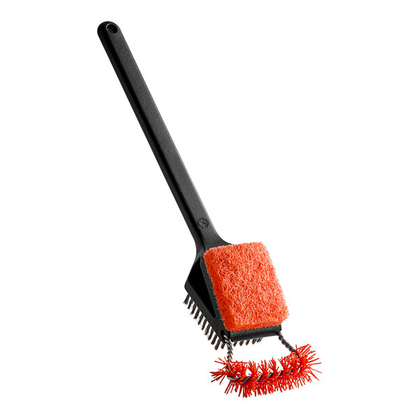 A black and orange brush with a black handle and bristles.