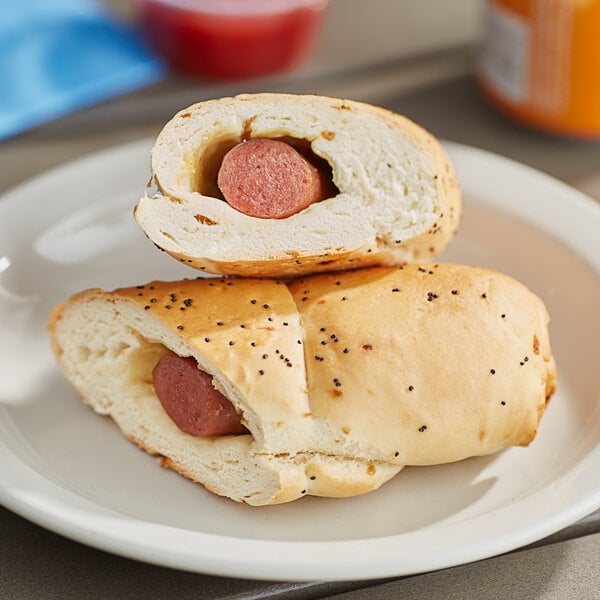 A Clara's Kitchen beef hot dog in a bun on a plate.