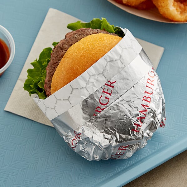 A hamburger wrapped in Bagcraft honeycomb foil.