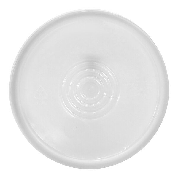 A white plastic lid with a circle in the middle.