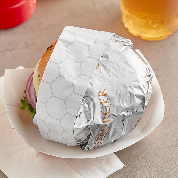 A cheeseburger wrapped in Bagcraft honeycomb foil.