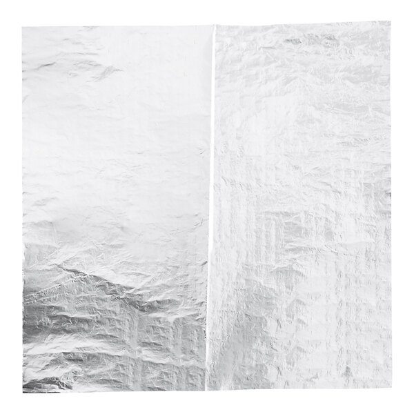 A close-up of a crumpled piece of silver honeycomb foil.