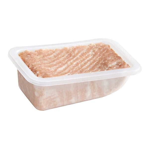 A plastic container with Oshi vegan salmon filet inside.