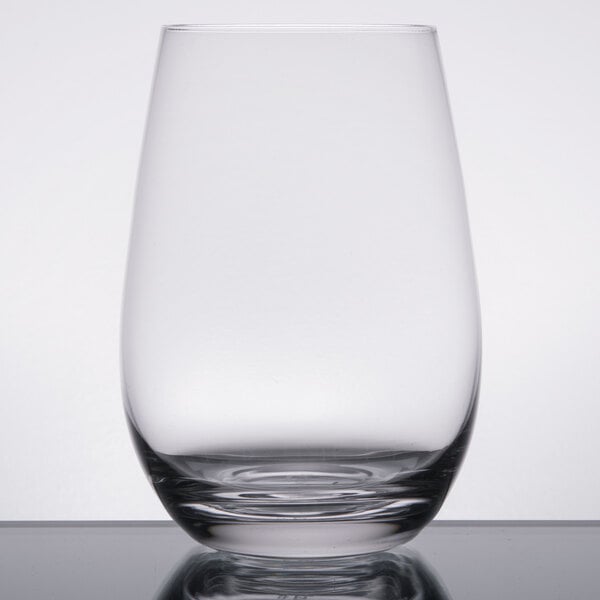 A close up of a clear Stolzle stemless wine glass on a table.