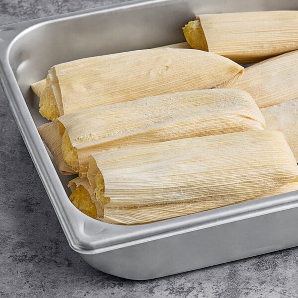 A tray of Tucson Foods Green Chile and Chicken Tamales on a table.