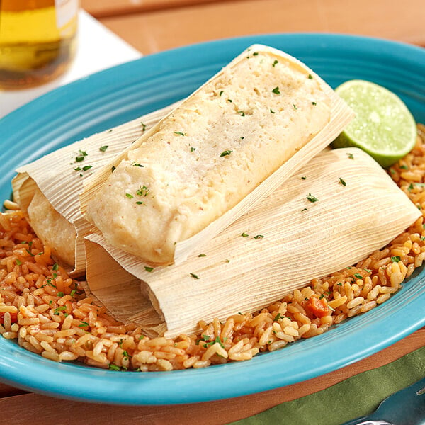 A Tucson Foods Green Chile and Pork Tamale on a plate.