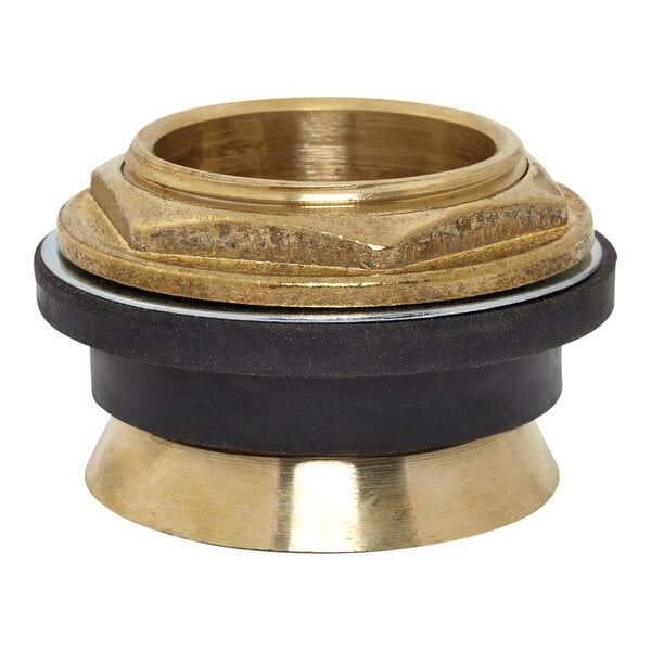 An American Standard brass and black metal toilet spud on a table.