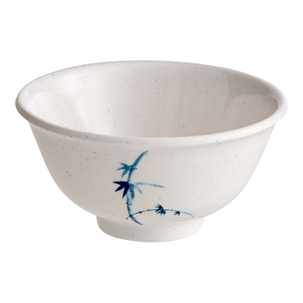 A white bowl with blue and white speckled designs.