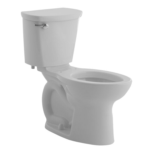 An American Standard white floor-mount chair height toilet with a silver handle and lid.