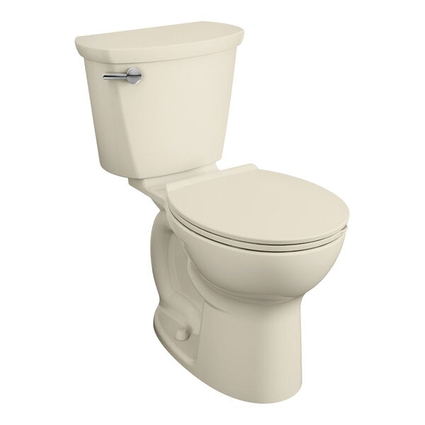 An American Standard Cadet PRO Bone Vitreous China toilet with the seat down.
