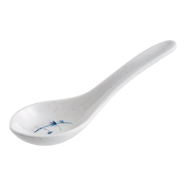 A white spoon with a blue and white speckled design.