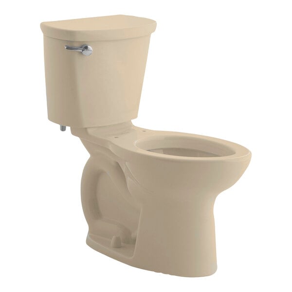 An American Standard Cadet PRO bone colored toilet with a silver handle.