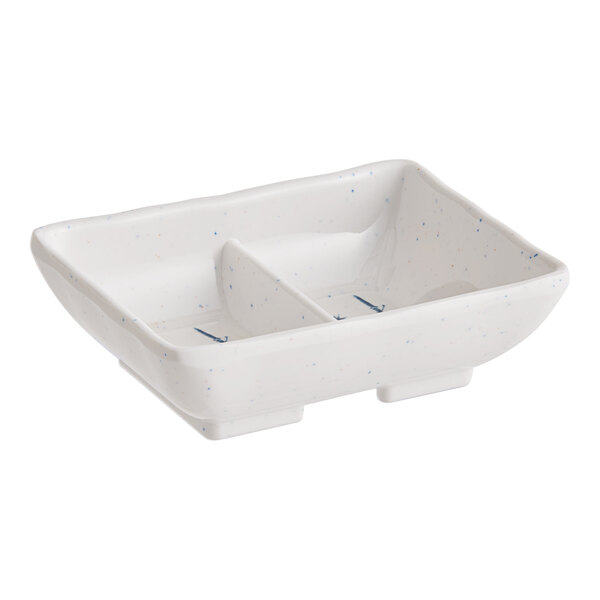 A white rectangular Acopa Biru dish with blue speckled spots.