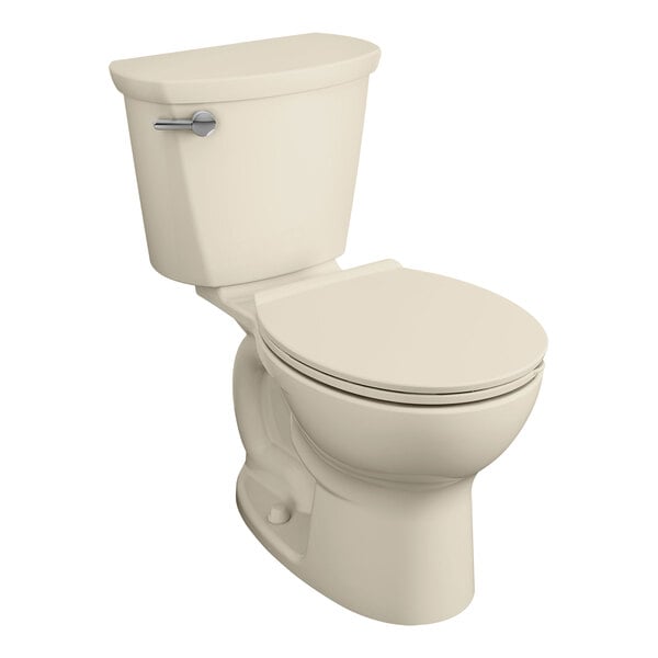 An American Standard Cadet PRO bone vitreous china floor-mount round toilet with the seat down.