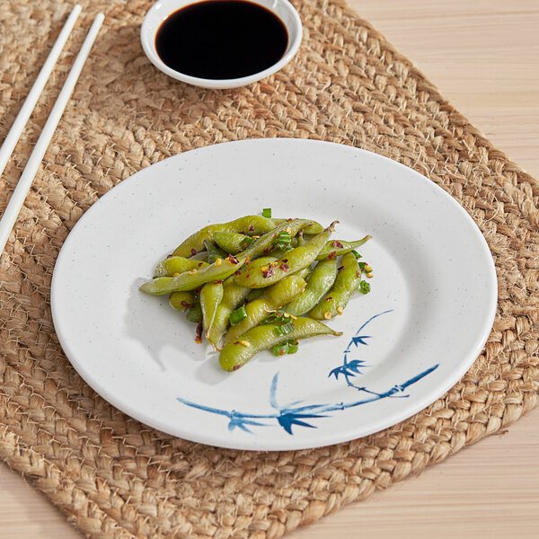 An Acopa Bambu Biru melamine plate with green beans and chopsticks on it.