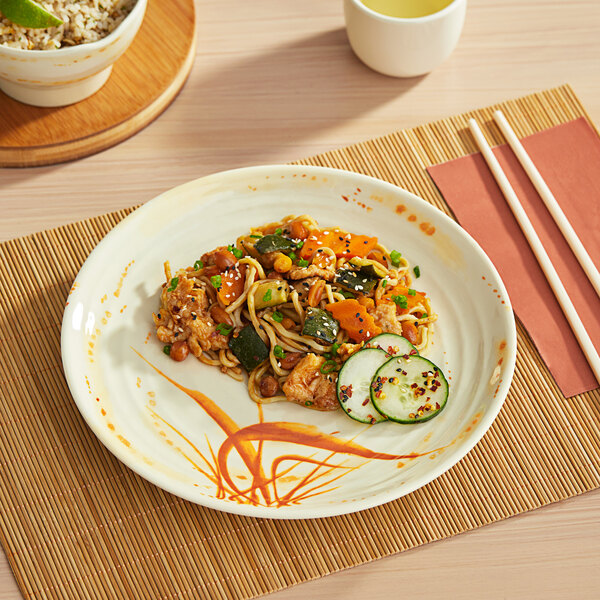 An Acopa Brassia melamine plate with food on a table.