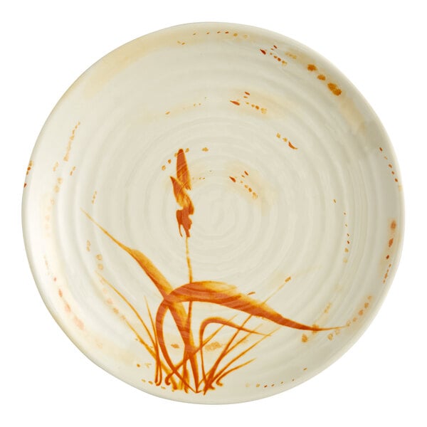 A close up of a white Acopa melamine plate with orange and brown grass design.