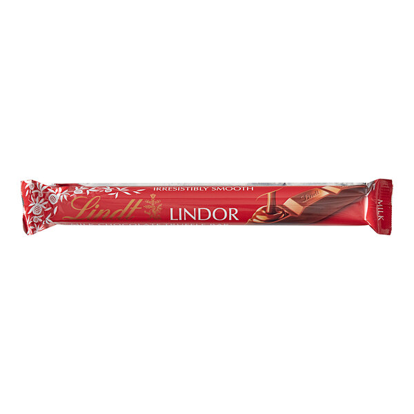 A close up of a Lindt Lindor milk chocolate truffle bar in red and white packaging.