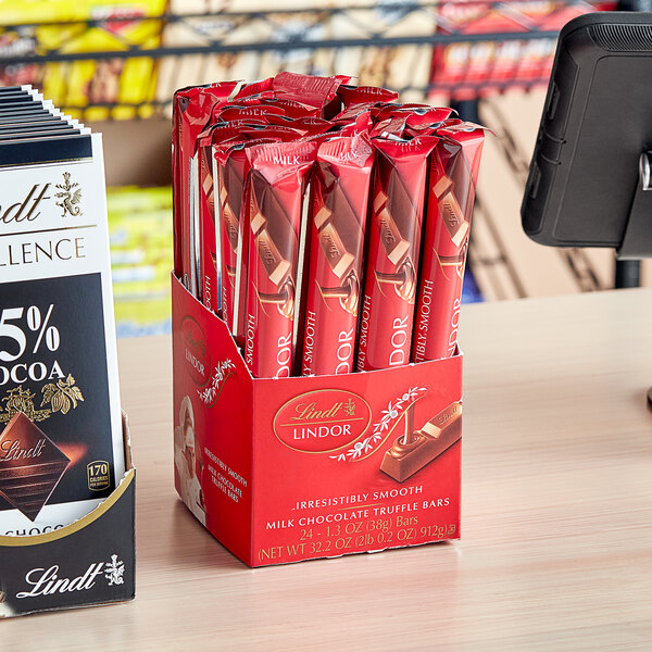 A black case of 192 Lindt Lindor milk chocolate truffle bars.