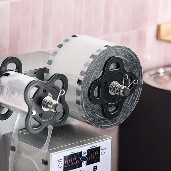 Clear sealing film for PP cups on a sealing machine.