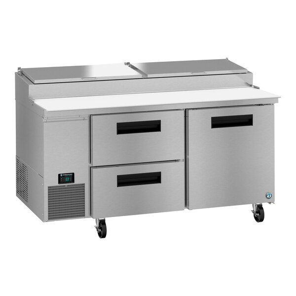 A stainless steel Hoshizaki pizza prep table with two drawers.