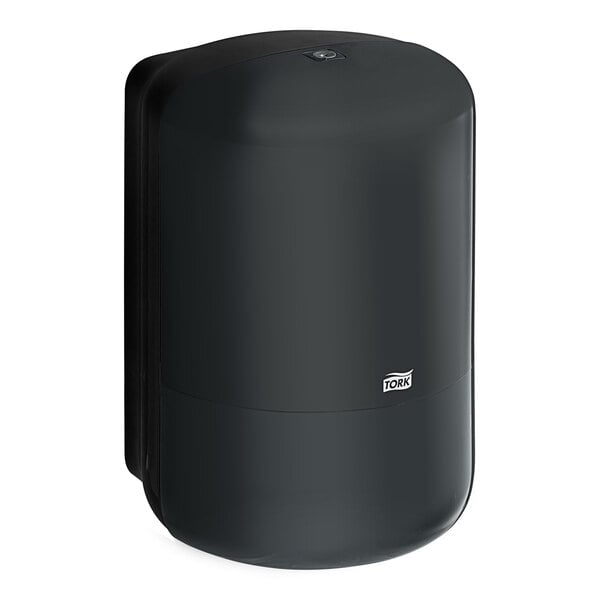 A black plastic Tork wall-mount center pull paper towel dispenser.