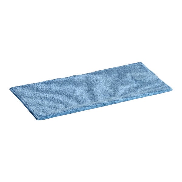A blue microfiber cloth on a table in a blank background.