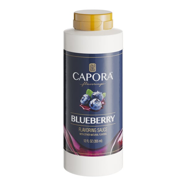 A white Capora bottle with a blue label and white text reading "Blueberry Flavoring Sauce" with blue berries.