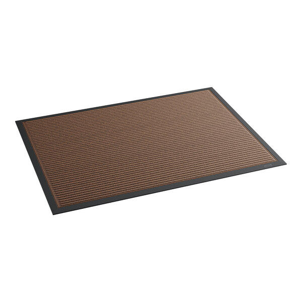 A brown rectangular rug with black trim.