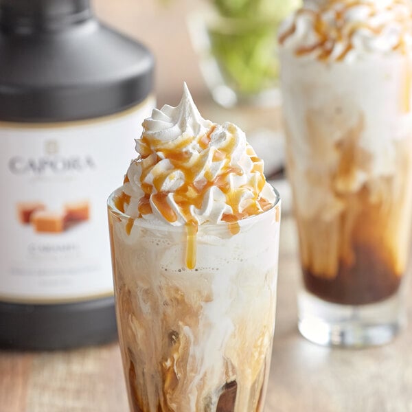 A glass of ice cream with Capora caramel sauce and whipped cream.