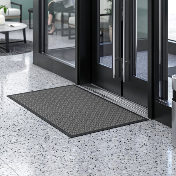 A black Lavex parquet entrance mat with a gray pattern.