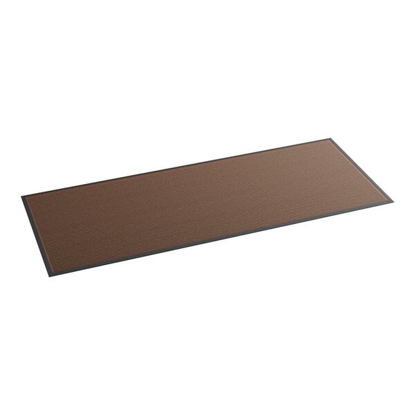 A rectangular brown mat with black border.