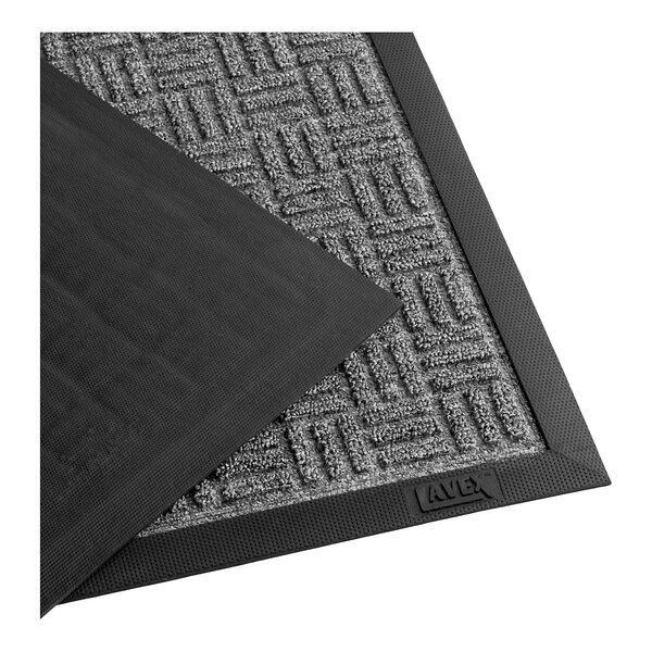 A grey parquet Lavex indoor entrance carpet with black rubber backing.