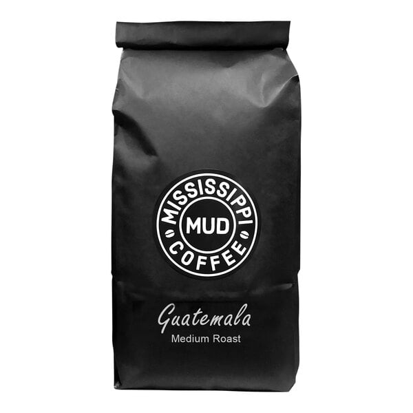 A black bag of Mississippi Mud Guatemala Medium Roast Whole Bean Coffee with white text.