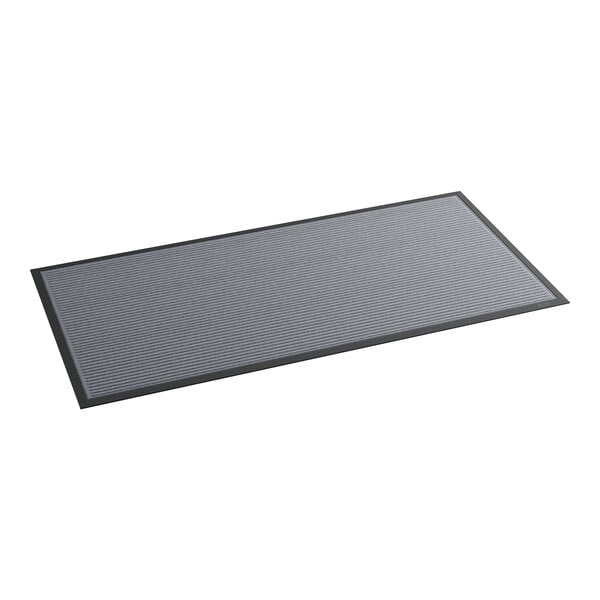 A grey rectangular mat with black border.
