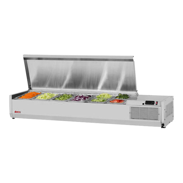 A stainless steel Turbo Air countertop salad prep table with a variety of vegetables in containers on a counter.