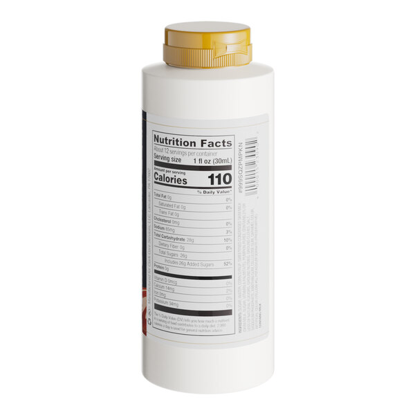 A white Capora bottle of Pumpkin Pie Flavoring Sauce with a yellow label.