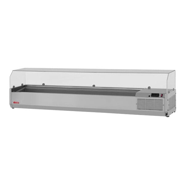 A Turbo Air stainless steel refrigerated countertop salad prep table with clear hood on a counter.