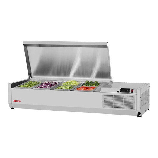 A Turbo Air stainless steel refrigerated countertop salad prep table with food trays filled with vegetables.
