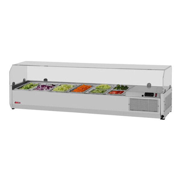 A Turbo Air refrigerated countertop salad prep table with a clear hood full of vegetables and salads.