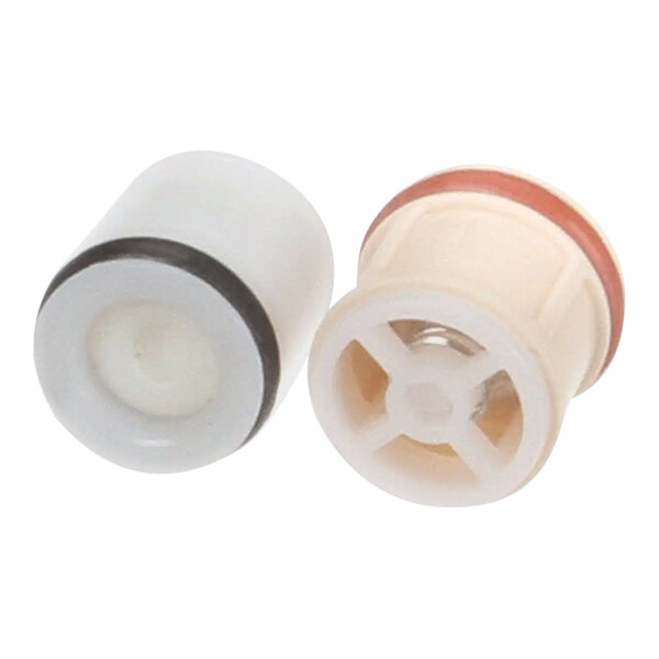 Two white and black plastic check valves with round white and black plastic pieces.