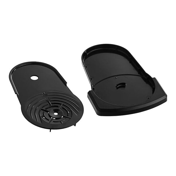 A black plastic drip tray with a round hole in it.