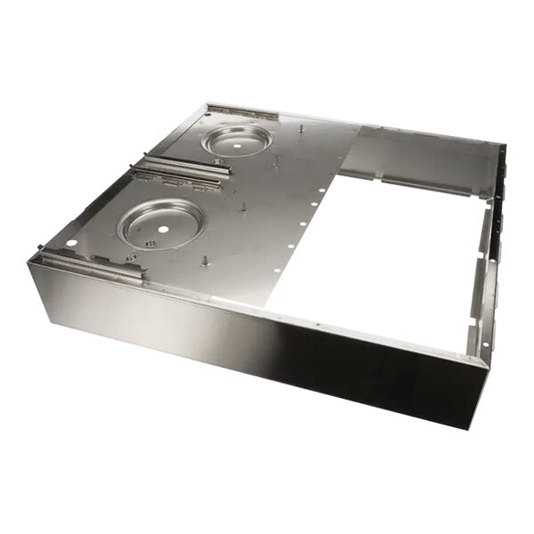 A metal plate with holes in a metal frame.