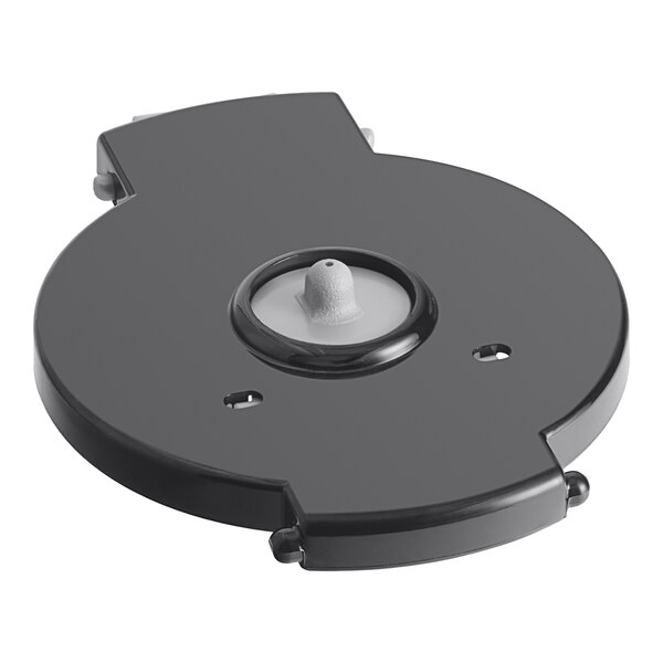 A black circular cover with a white circle on it.