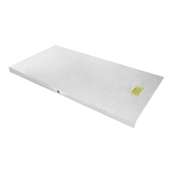 A white rectangular Traulsen assembly hump cover with a yellow label on it.