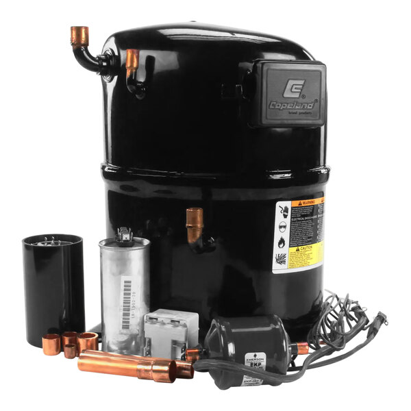 A black Scotsman compressor with copper pipes and wires.