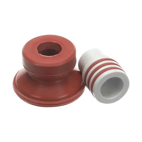 A close-up of a red and white plastic pipe fitting.