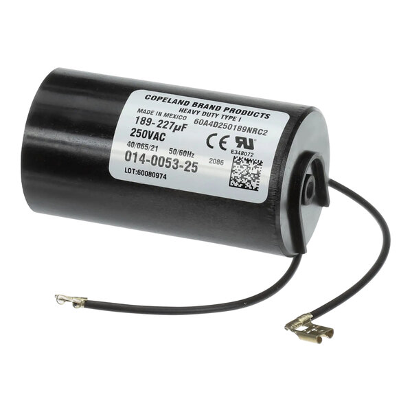 A black cylindrical Traulsen capacitor with a white label.