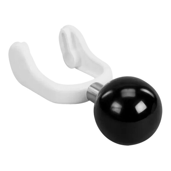 A white plastic object with a silver handle and black and white accents.
